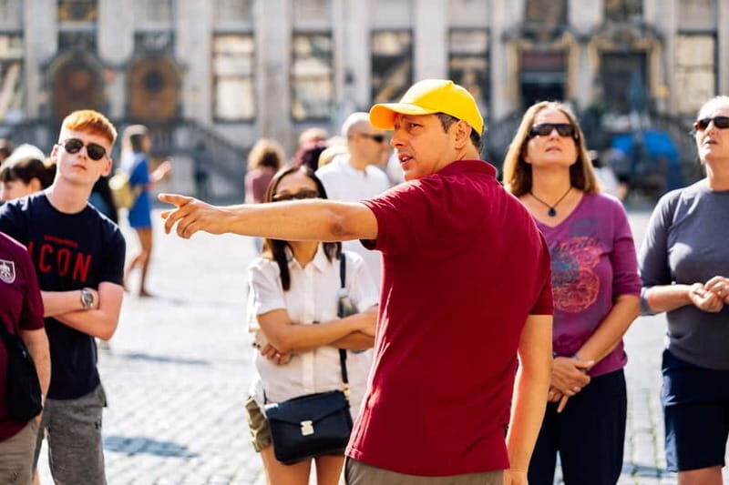 Brussels: Historical Tour with Chocolate & Waffle Tasting - Entering Brussels at Grand-Place: the 13 steps and the big tower