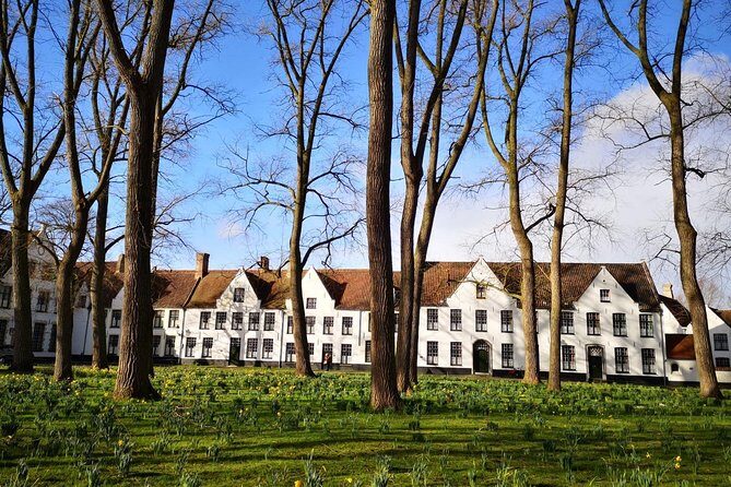 Excursion to Bruges and Ghent by bus from Brussels - Bruges on a guided “hits list”: canals, squares, and medieval women